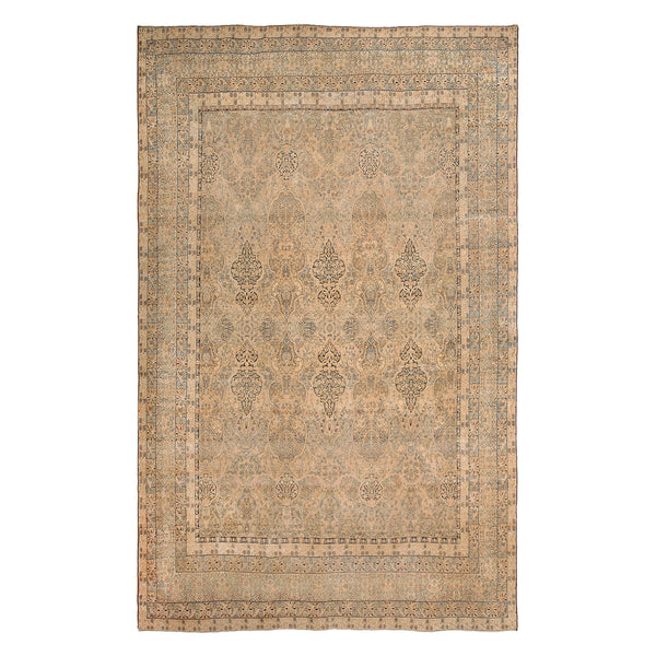 Ornate rectangular area rug with intricate floral and paisley-like pattern