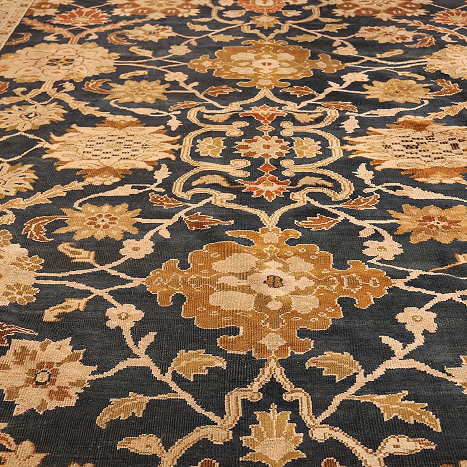 Exquisite Oriental-inspired carpet with intricate floral motifs and warm tones.
