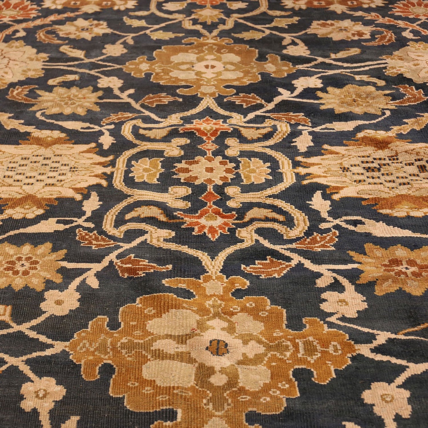 Close-up view of a Persian-style rug with intricate floral patterns.