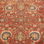 Close-up of a handwoven Persian carpet with intricate floral motifs.
