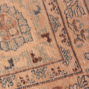 Intricate handcrafted woven fabric with geometric motifs in earth tones.