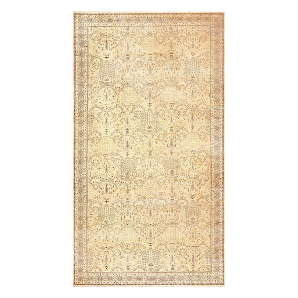 Intricate traditional rug with symmetrical motifs in beige and cream.