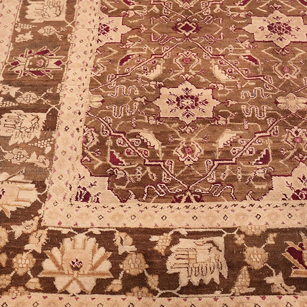 Exquisite traditional rug with intricate design in earthy tones.