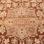 Intricate traditional oriental carpet design in warm earth tones.