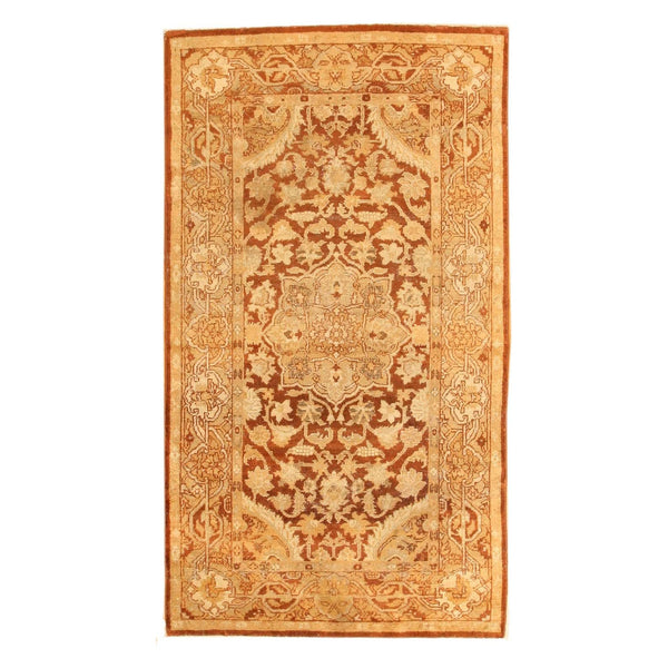 Traditional oriental-style rug with intricate floral design in brown tones.