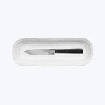 Classic table knife in black handle packaging with scalloped edge.