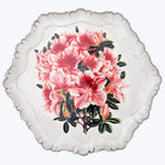 Decorative plate with scalloped edges featuring vivid pink floral design.