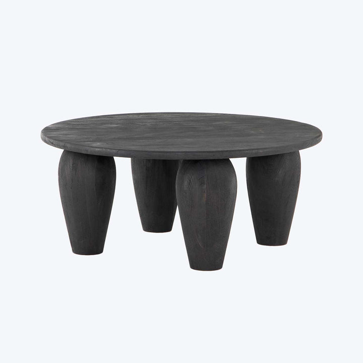Modern round table with unique design, dark matte finish.