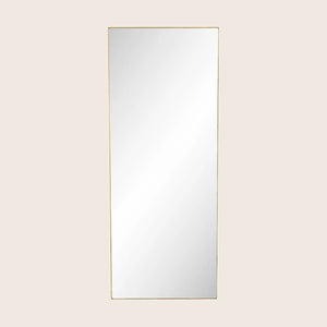 Minimalist gold-framed rectangular mirror on white background, vertical orientation.