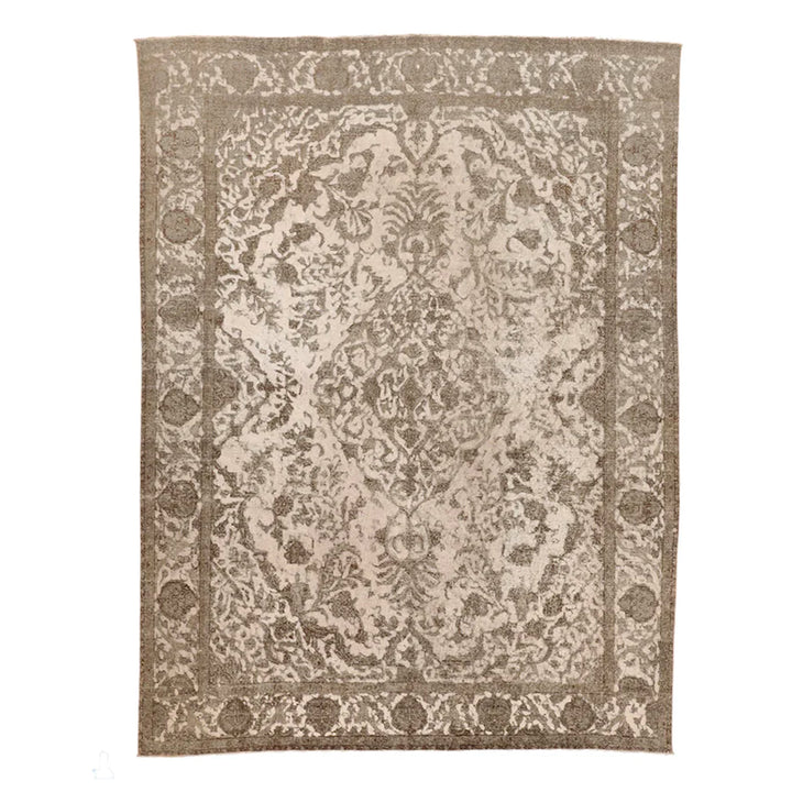 Ornate rectangular rug with floral and paisley motifs in beige