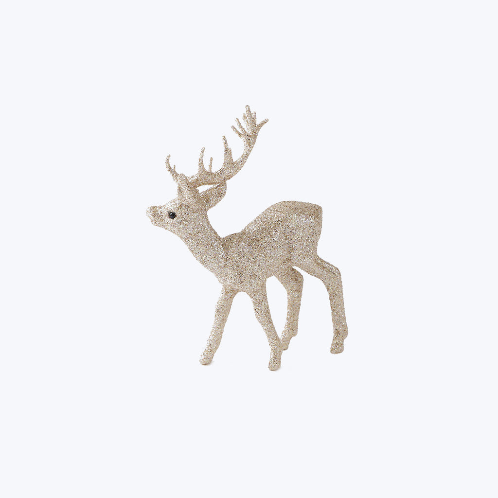 Glittery deer figurine with antlers on white background, holiday decoration.