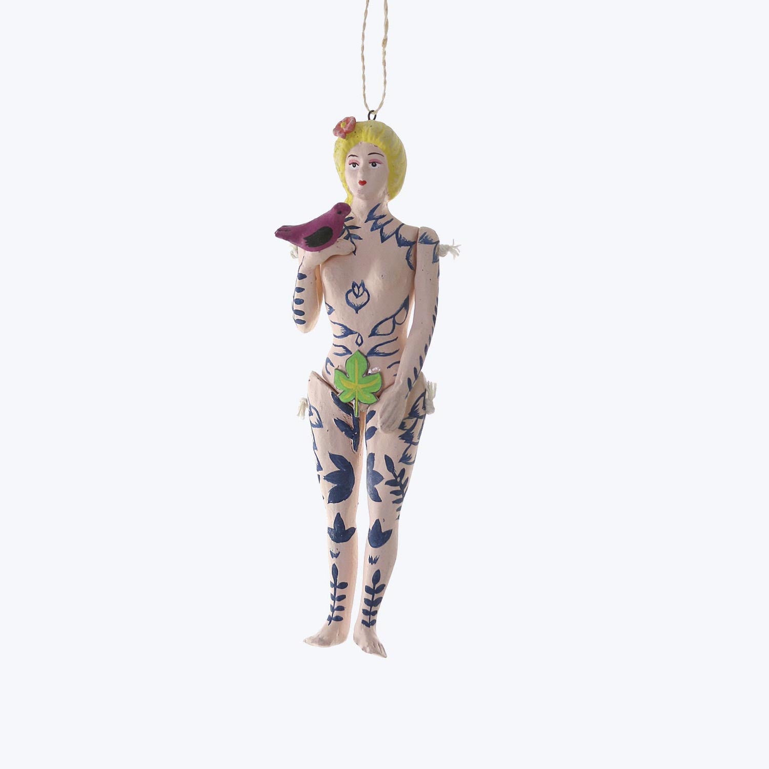 Decorative humanoid figurine with blonde hair, holding a bird ornament.