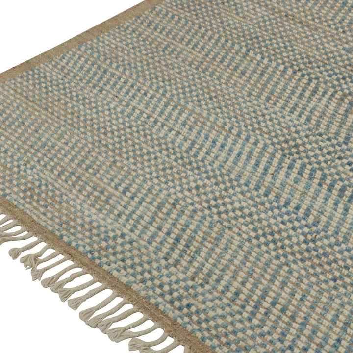 Close-up of blue and beige woven textile with checker pattern.