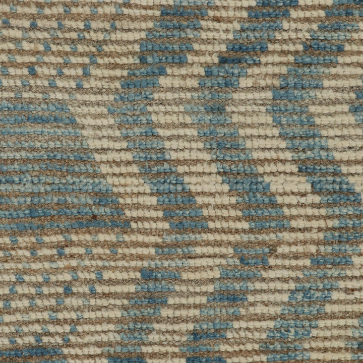 Close-up of textile with horizontal stripes in beige, white, blue.