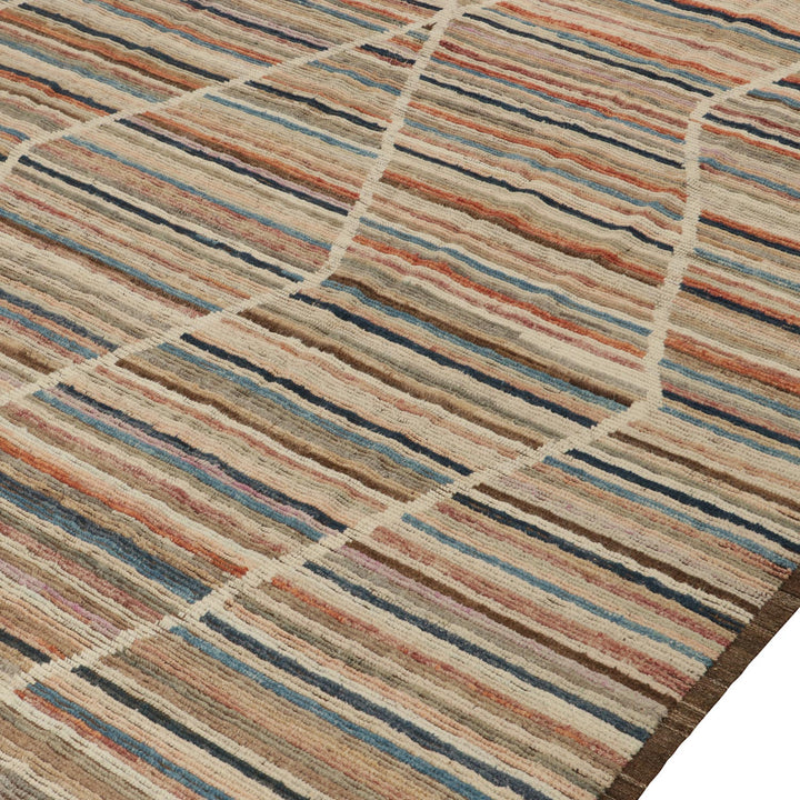 Close-up of textured rug with horizontal stripes in earth tones.