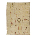 Geometric patterned handwoven rug in neutral tones with tribal motifs.
