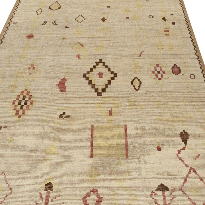 Hand-crafted rug with geometric design in muted colors and border.