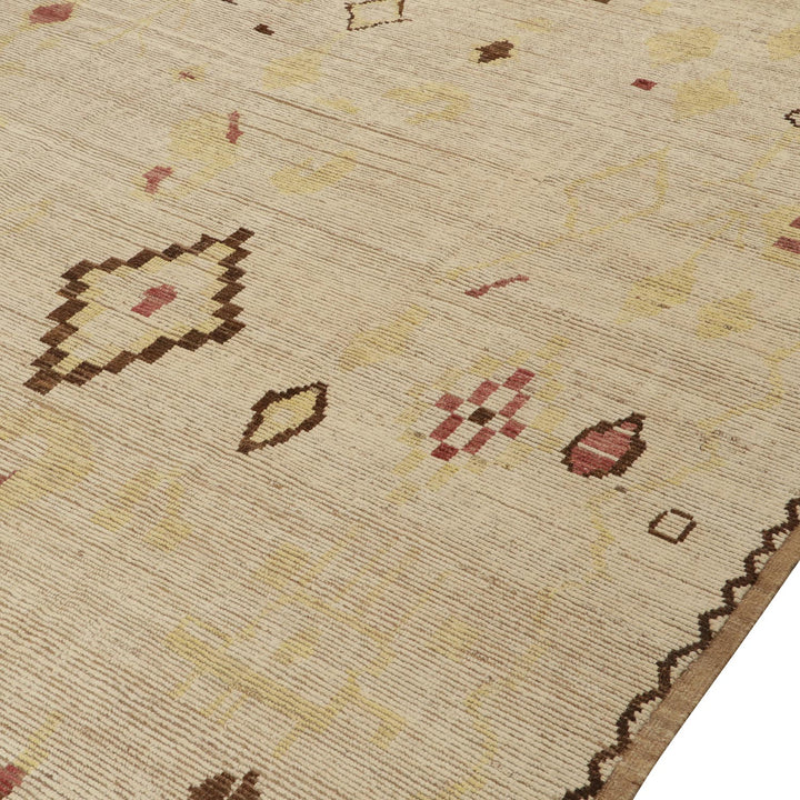 Neutral base rug with abstract symbols in browns, reds, pinks.