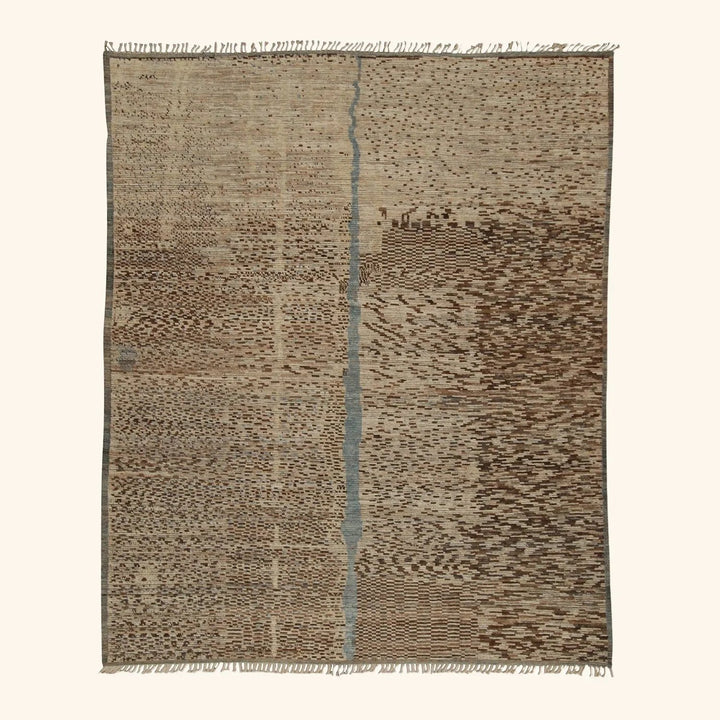 Handwoven beige and brown rug with blue stripe and fringe details