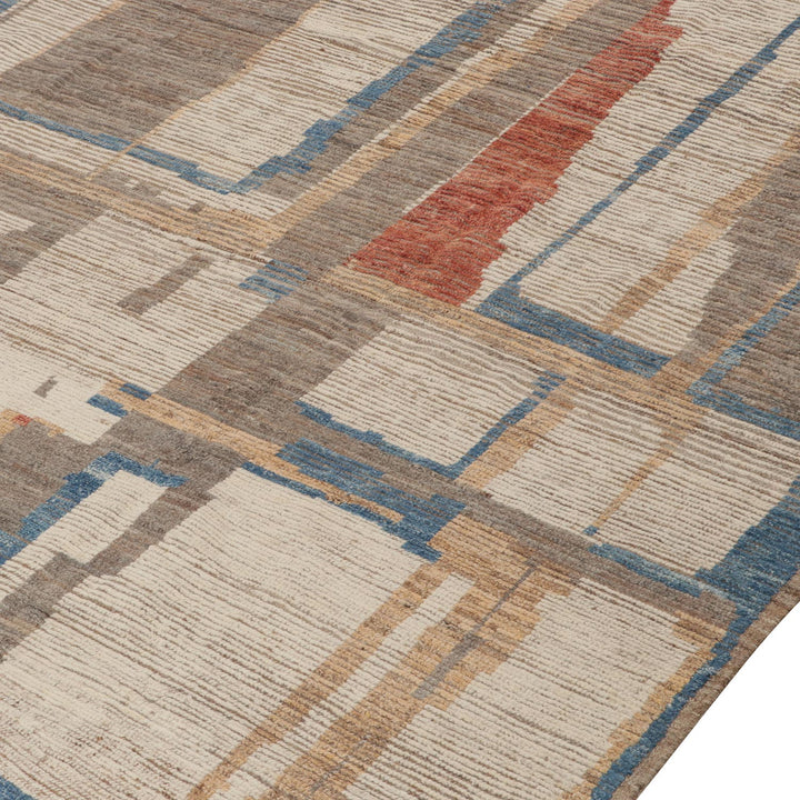 Modern geometric carpet with neutral colors and plush texture detail.