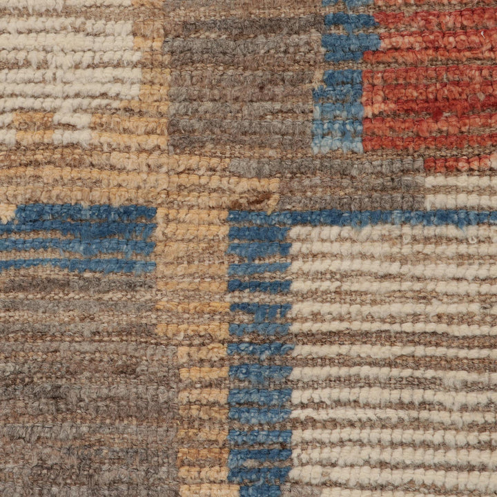 Close-up of woven texture with bands of brown, beige, blue.