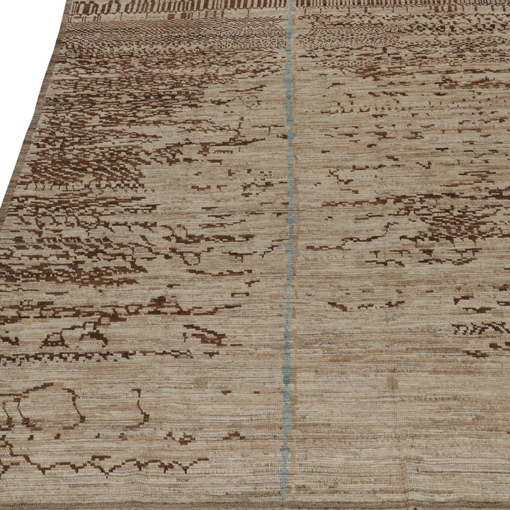 Close-up of abstract brown rug with blue crease fold detail.