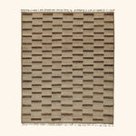 Modern rectangular area rug with geometric pattern in beige and brown.