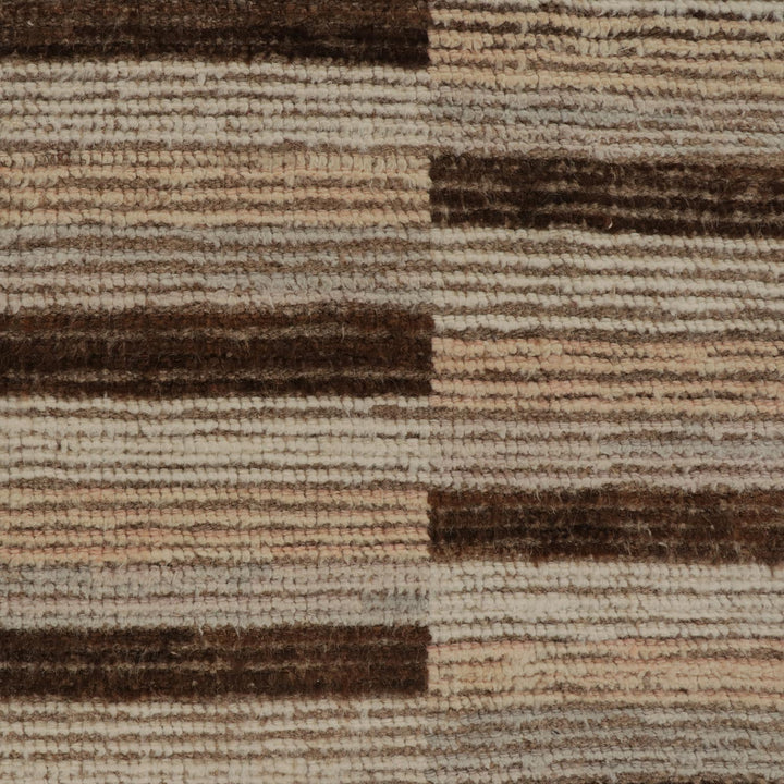 Close-up of striped fabric in various shades of brown and beige.