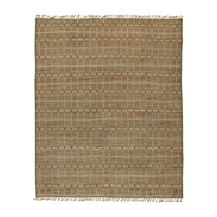 Natural jute area rug with fringe detail on neutral background.