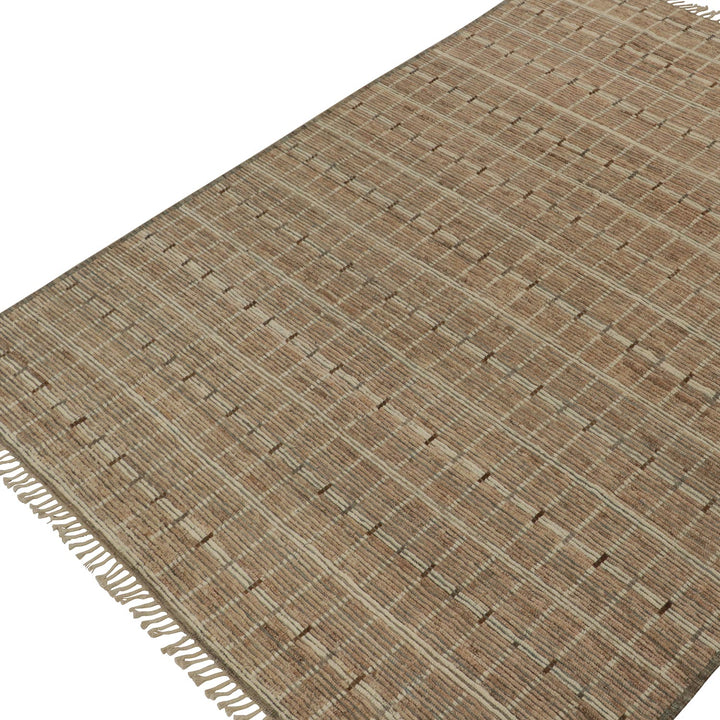 Textured rug with woven grid pattern in earthy tones, fringe edge.