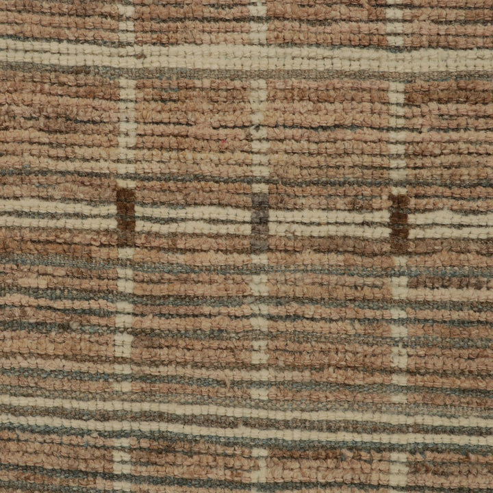 Close-up of textured fabric with horizontal stripes in earth tones.