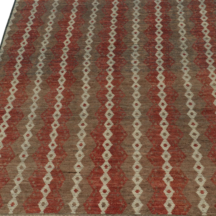 Geometric patterned fabric in red and beige with precise design.