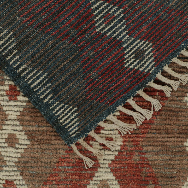 Close-up view of two handcrafted rugs with intricate designs