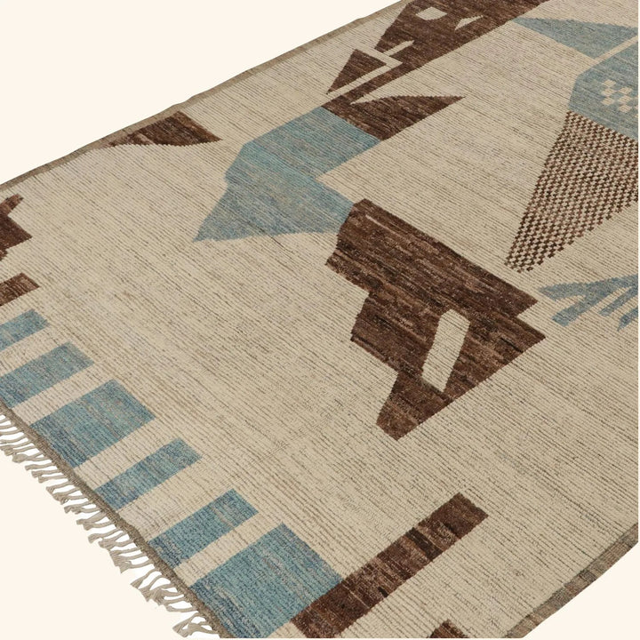 Close-up of textile rug with geometric blue and brown pattern.