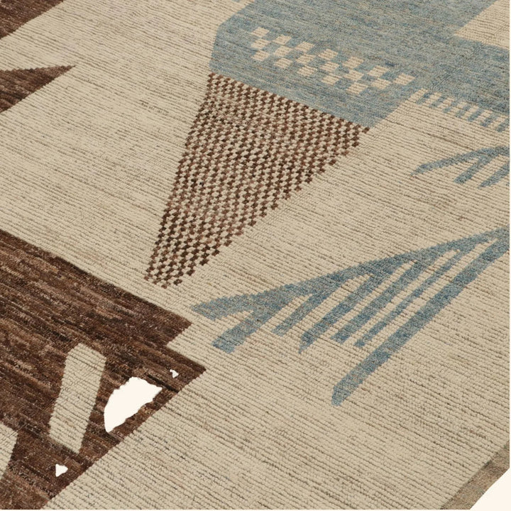 Close-up of modern geometric patterned carpet in brown and blue.
