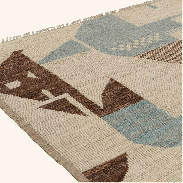 Abstract geometric patterned rug with fringe in blue, brown tones