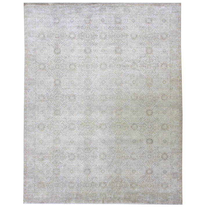 Vintage rectangular area rug with faded geometric design in muted colors.