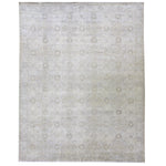 Vintage rectangular area rug with faded geometric design in muted colors.