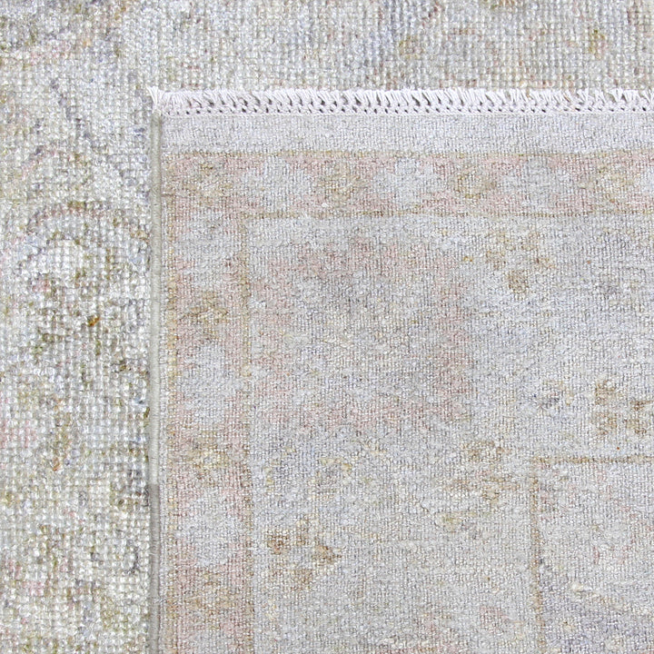 Close-up of soft, nubby woven rug with subtle pattern.
