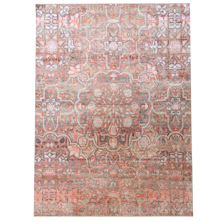 Intricate vintage rug with geometric and floral designs in muted tones.