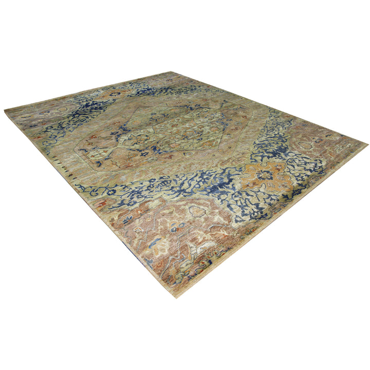 Intricate vintage rug with medallion design in muted blue tones.