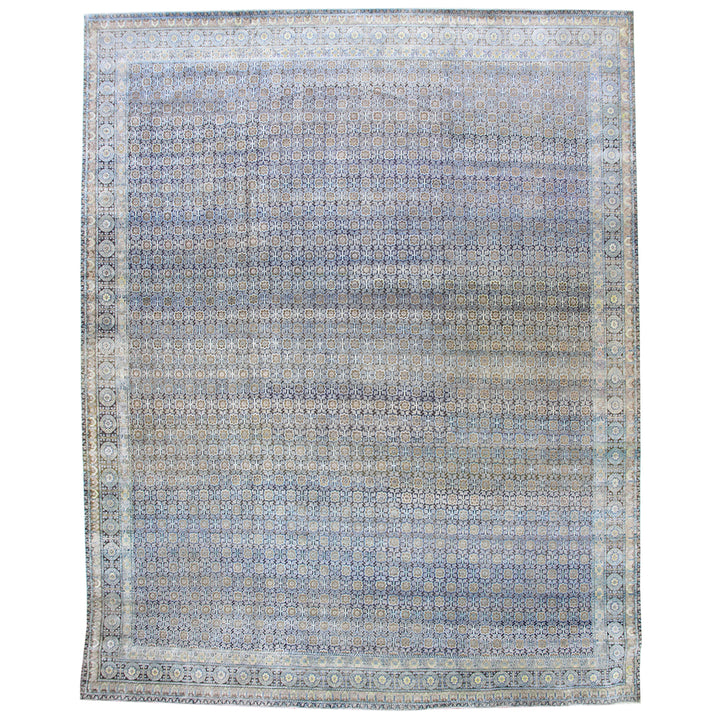 Ornate rug with intricate geometric and floral designs in blues.