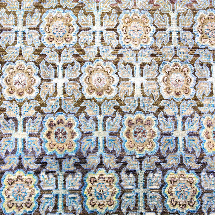 Intricate floral patterned textile with symmetrical design in various colors.