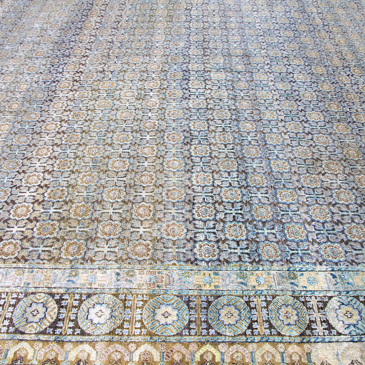 Intricate Islamic tilework with floral and geometric patterns in historic building.
