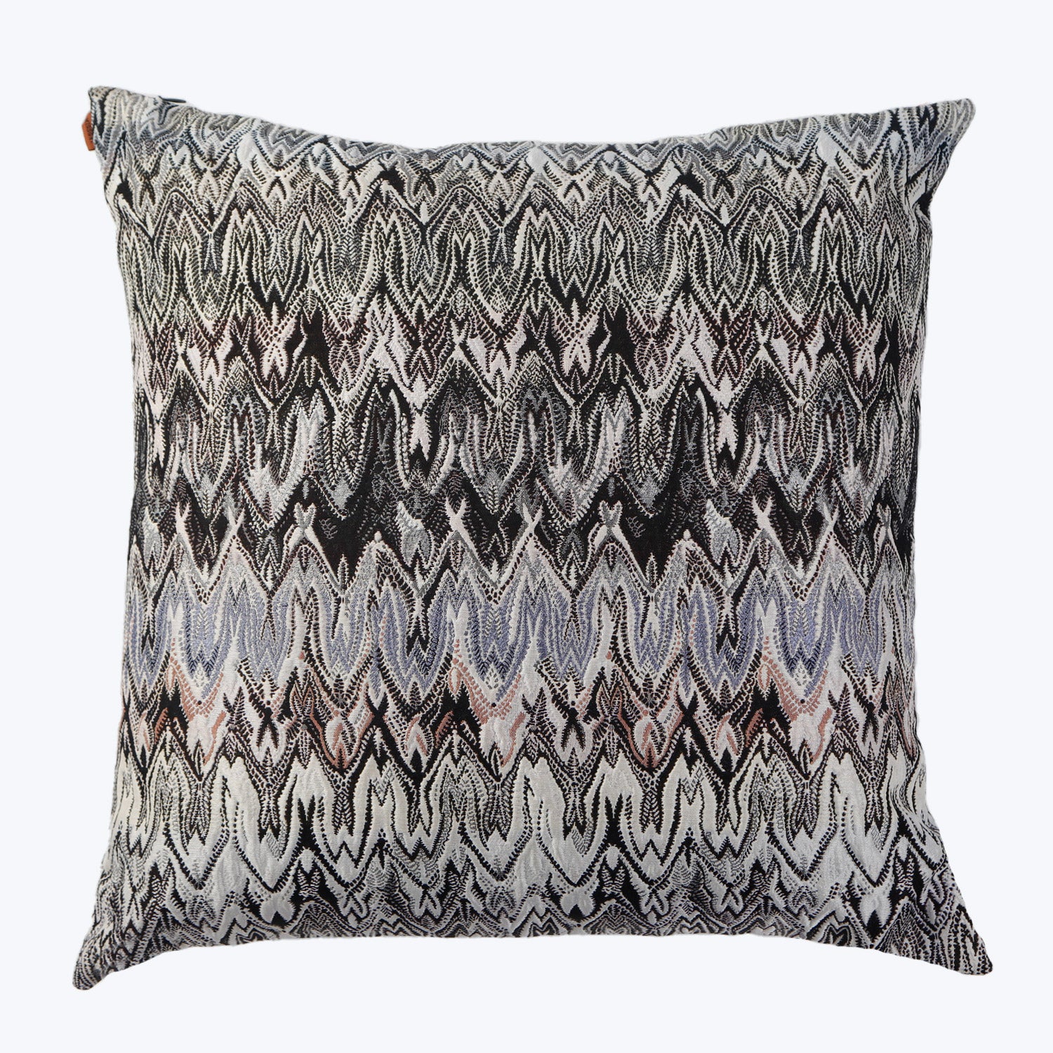 Decorative square pillow with zigzag pattern in black, white, gray.