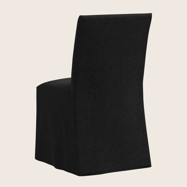Modern black chair with sleek silhouette and high backrest design