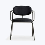 Modern chair with black metal frame and dark fabric upholstery.
