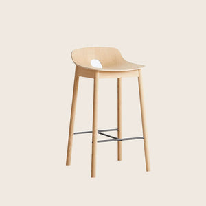 Modern minimalist bar stool with light wood finish and metal footrest.