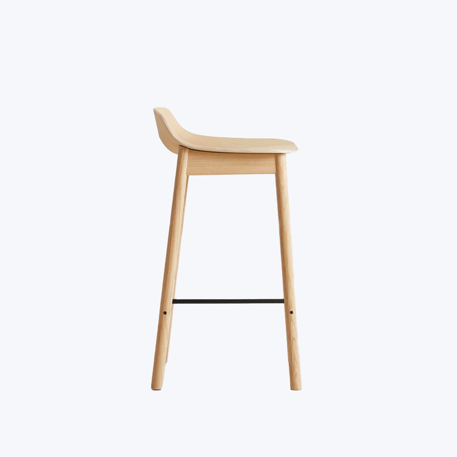 Minimalist modern bar stool with curved wood seat and footrest.