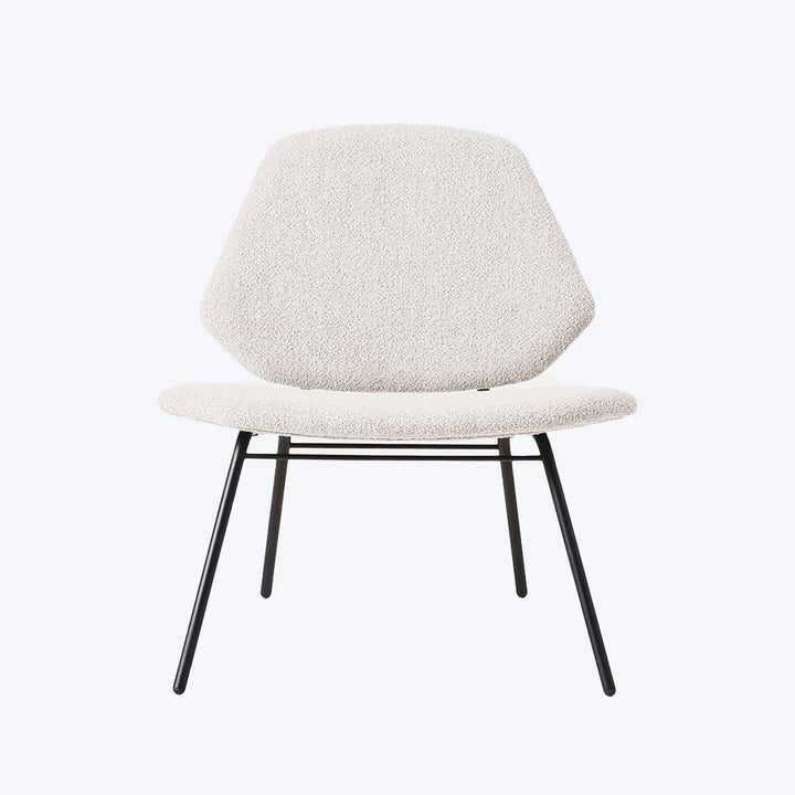 Modern minimalist chair with textured upholstery and sleek metal legs.